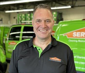 Male in front of SERVPRO equipment